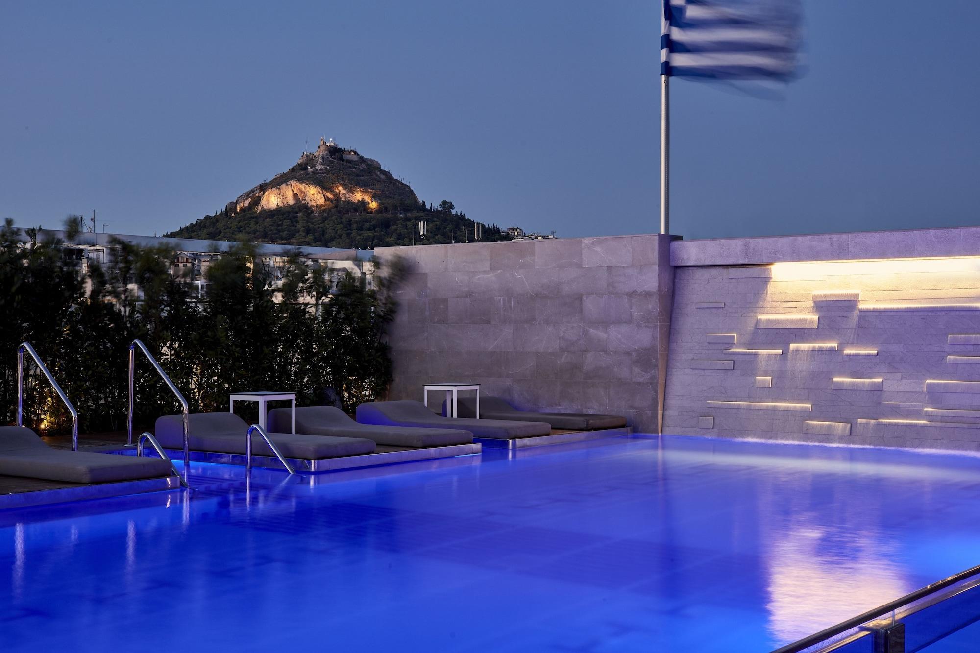 Electra Metropolis Hotel Athena Bagian luar foto The pool at the hotel